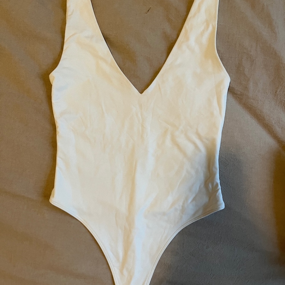 Aritzia White V‑Neck Sleeveless Bodysuit